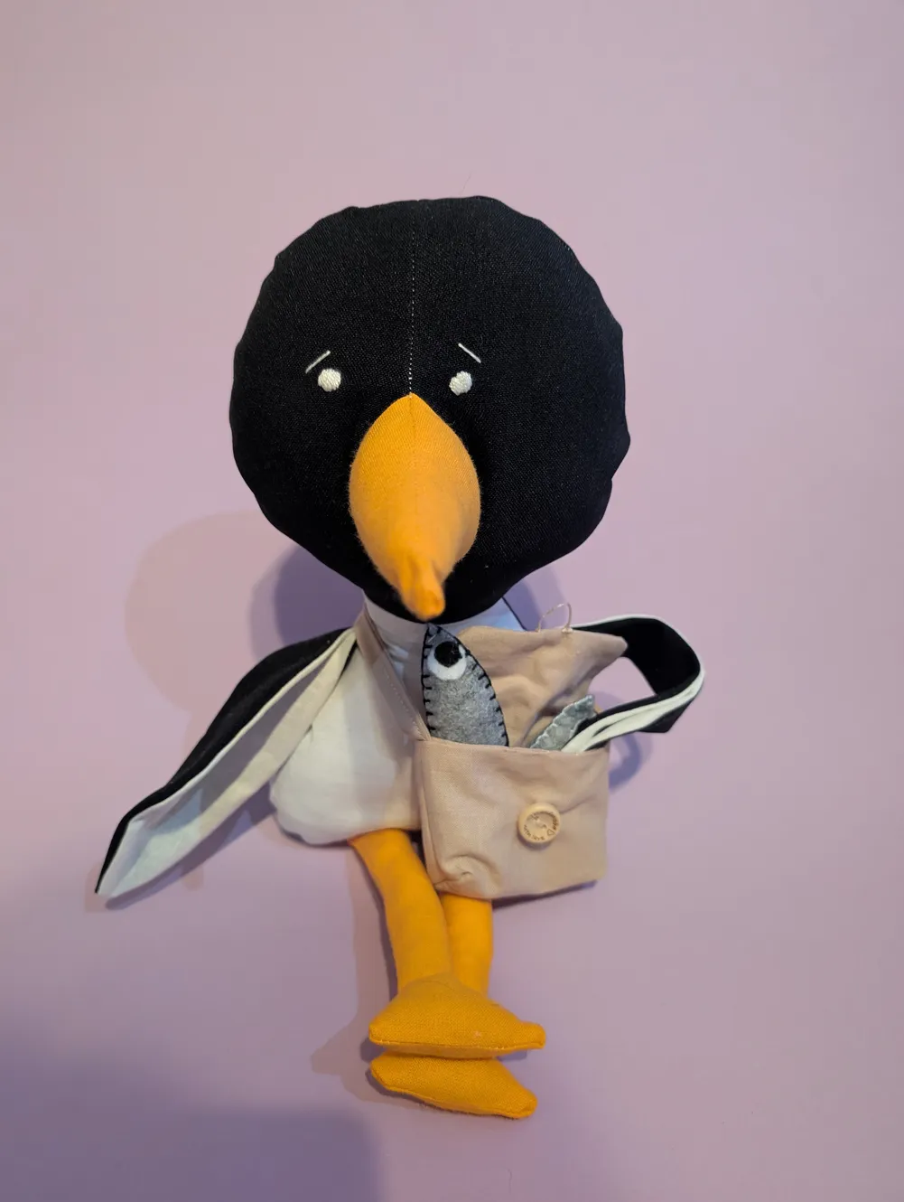 Penguin with beige bag