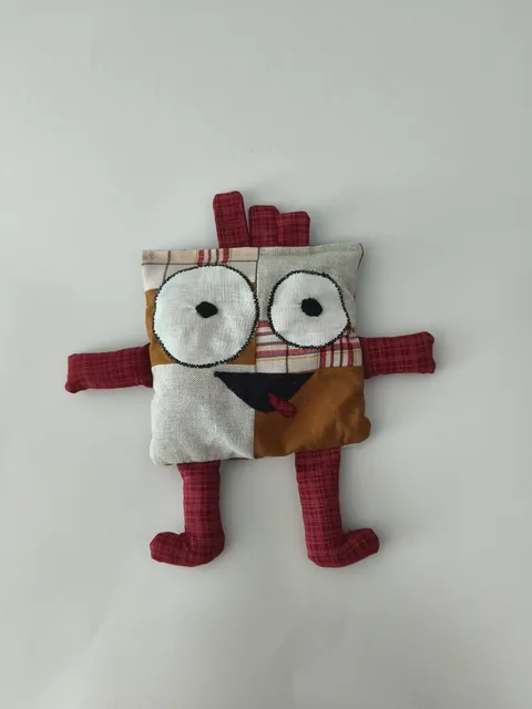 Stress doll with square pattern